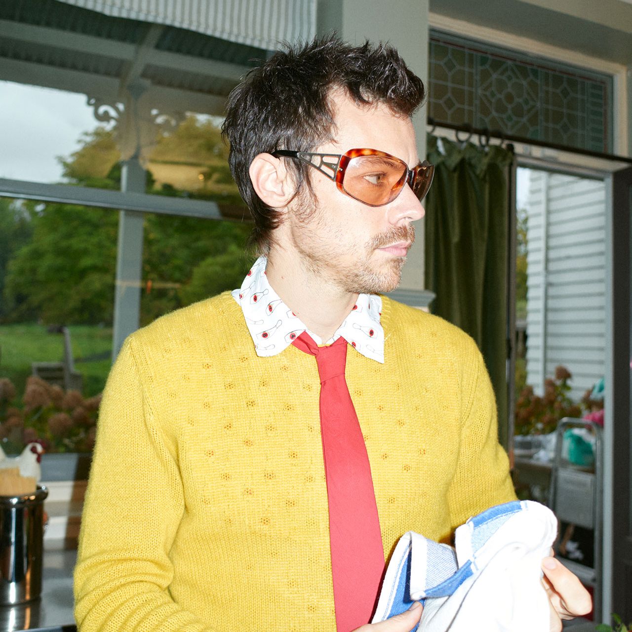 Image may contain Harry Styles Accessories Glasses Formal Wear Tie Face Head Person Photography and Portrait