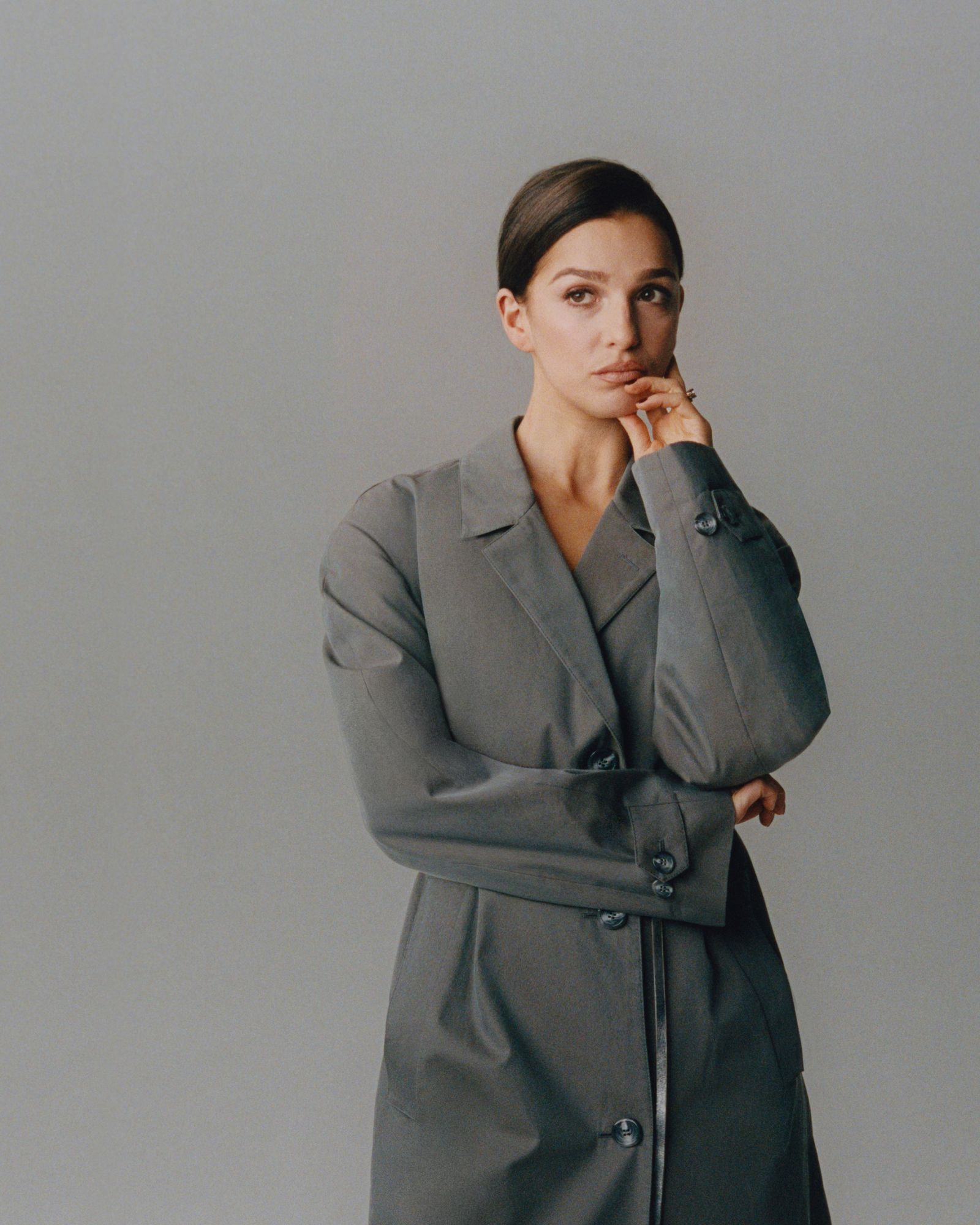 Image may contain Clothing Coat Blazer Jacket Formal Wear Suit Head Person Face Adult Photography and Portrait