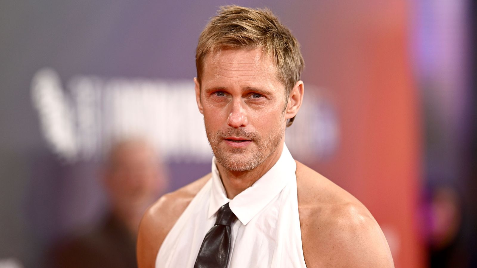 Image may contain Alexander Skarsgård Blonde Hair Person Accessories Formal Wear Tie Adult Necktie Face and Head