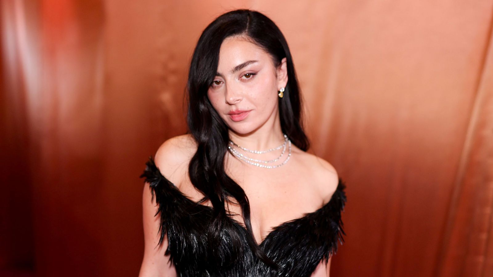 Image may contain Charli XCX Black Hair Hair Person Face Head Photography Portrait Adult Accessories and Jewelry