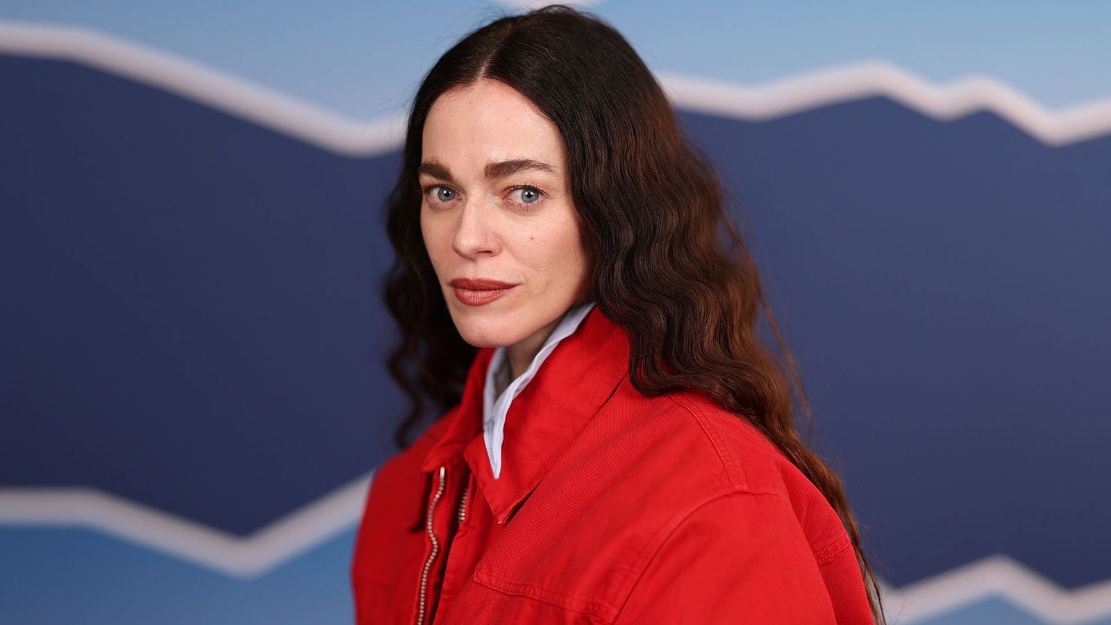 Image may contain Hailey Gates Clothing Coat Jacket Face Head Person Photography Portrait Adult and Body Part