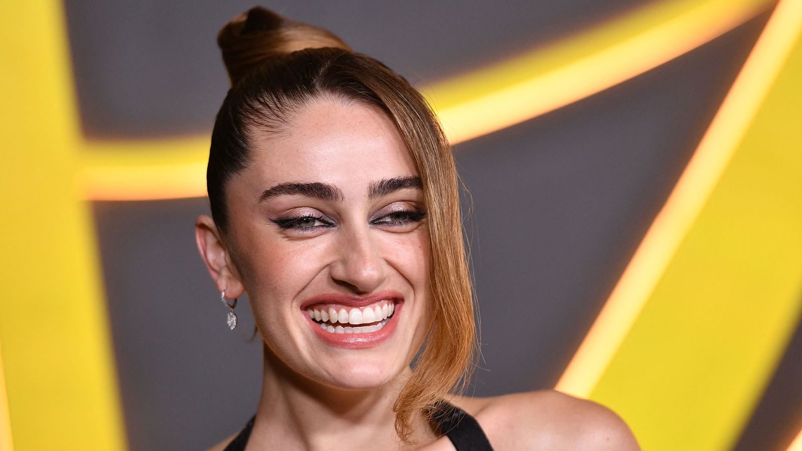 Image may contain Face Head Person Happy Smile Adult Laughing and Dimples