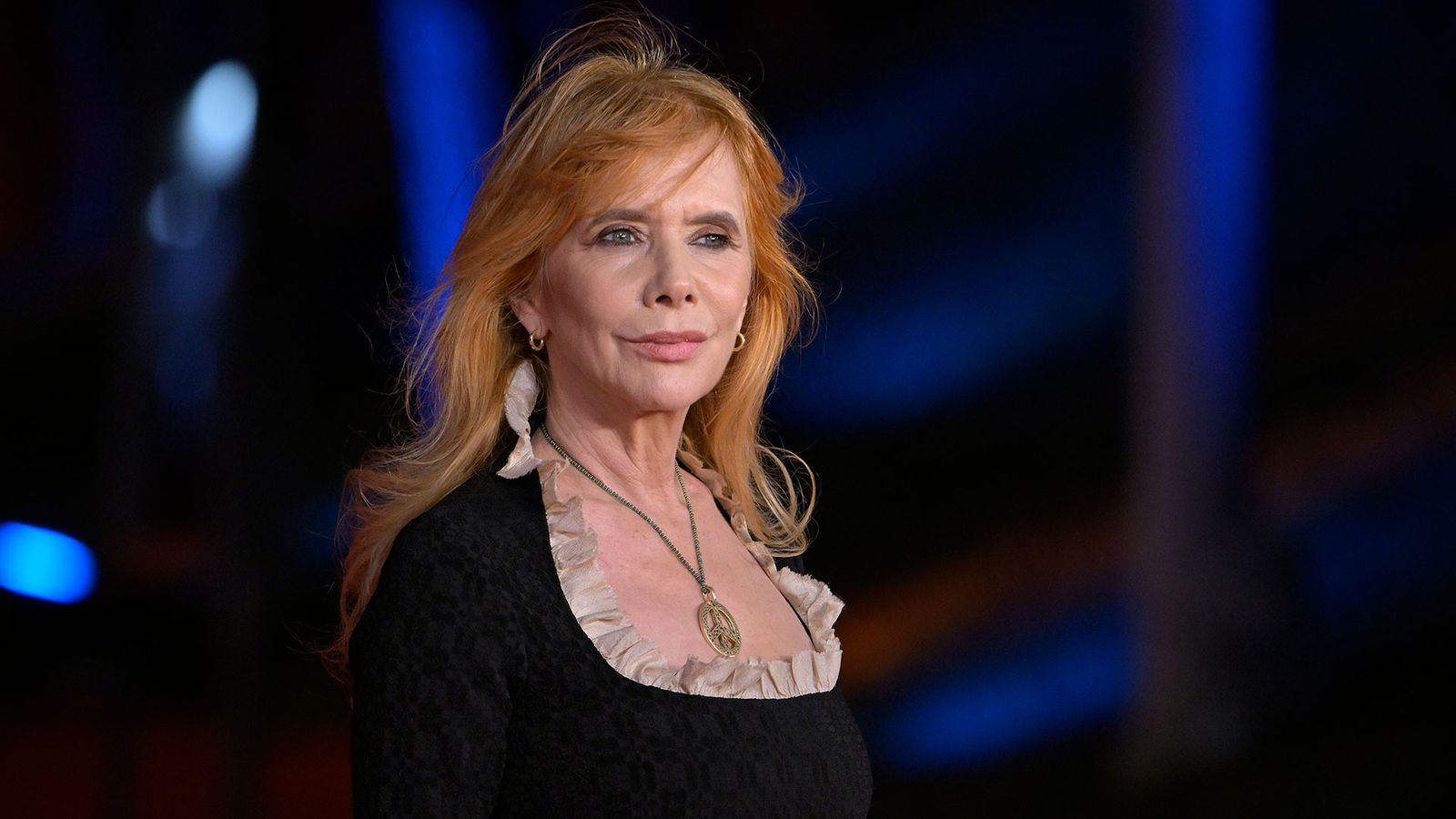 Image may contain Rosanna Arquette Blonde Hair Person Accessories Pendant Adult Jewelry Necklace Face and Head