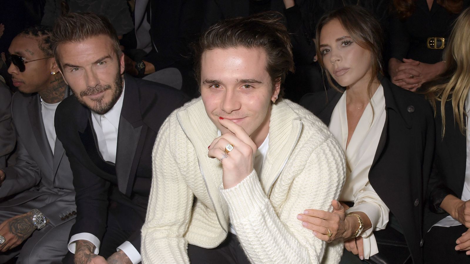 Image may contain Brooklyn Beckham Clothing Knitwear Sweater Head Person Face Accessories Jewelry Ring and Adult